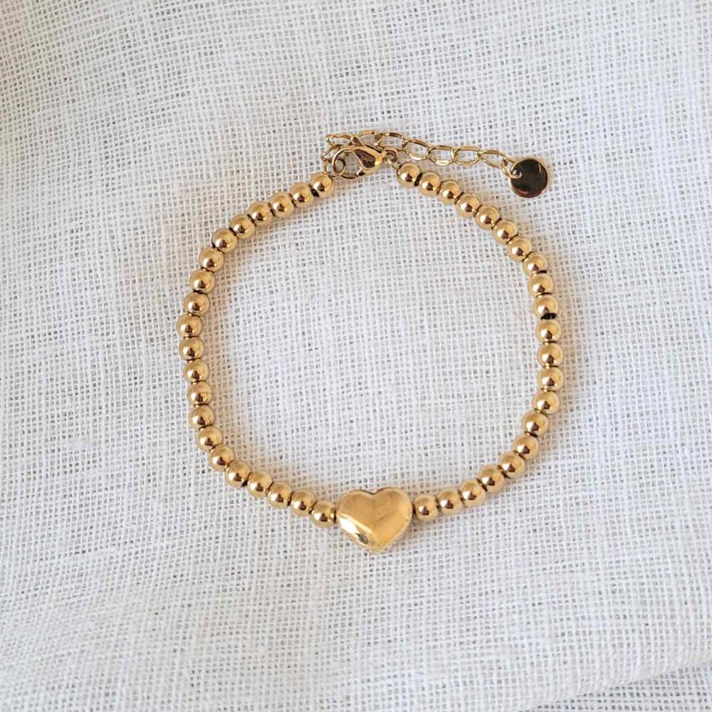 Gold beaded deals bracelet with charm